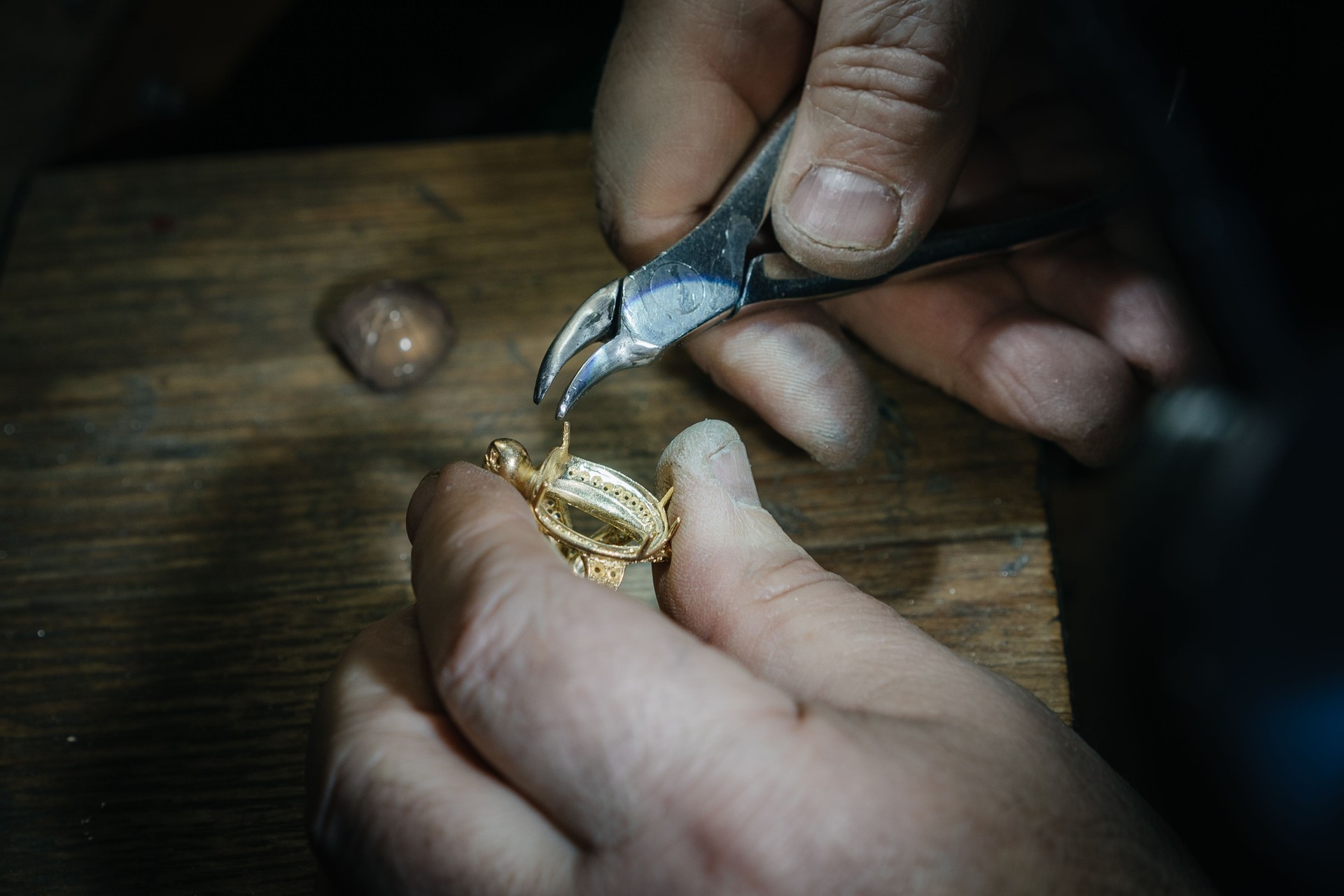 Craft jewelery making. Ring repairing. Putting the gems on the ring. Macro shot.